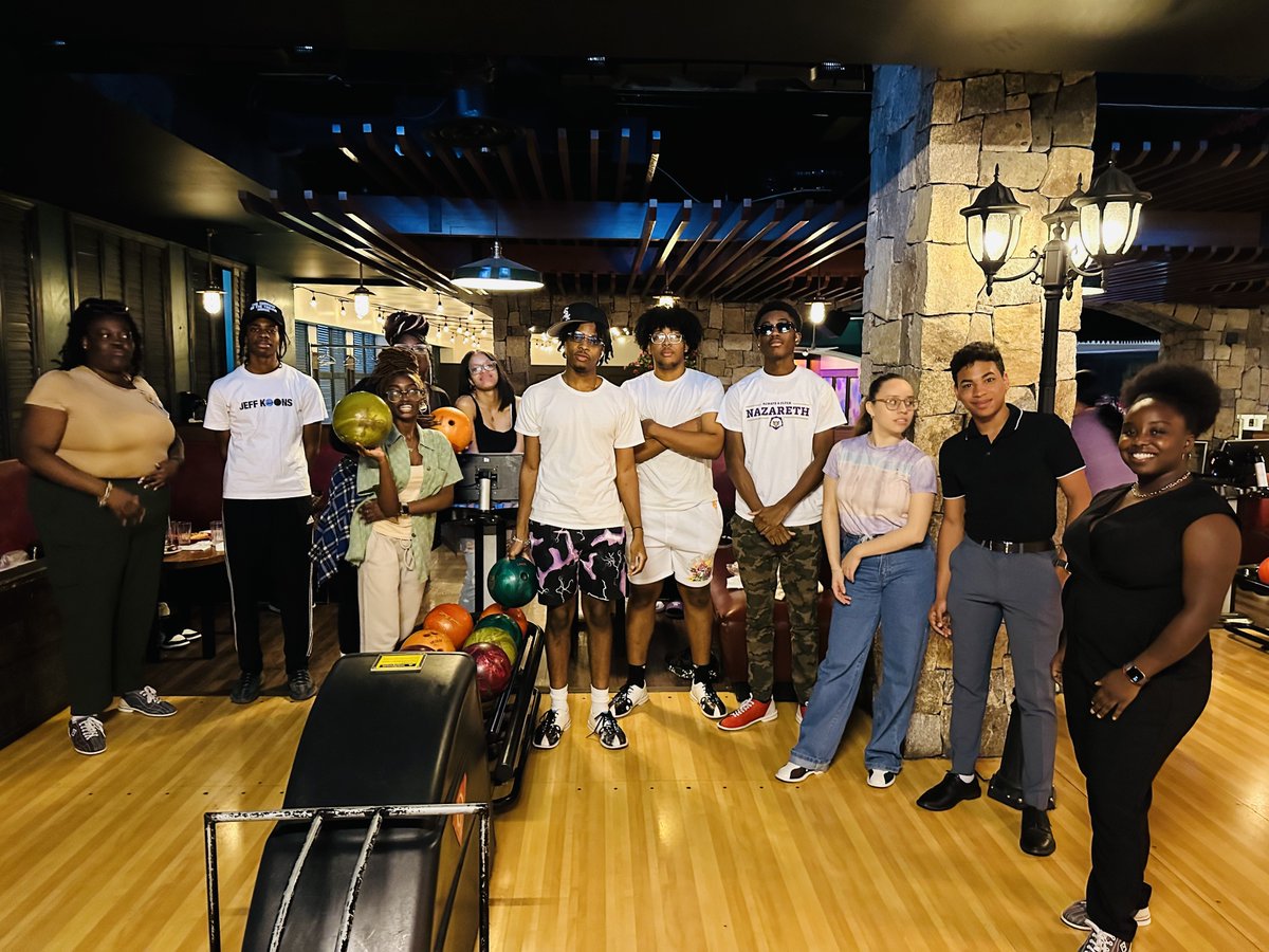 Nazuniversity's tweet photo. Naz Admissions traveled to New York City to celebrate #NazBound students in their own backyard. Students connected with each other and us for bowling and fun at Bowlero Times Square! We love celebrating all our #NazBound students! 💜 💛 https://t.co/MLuCqq76ZW