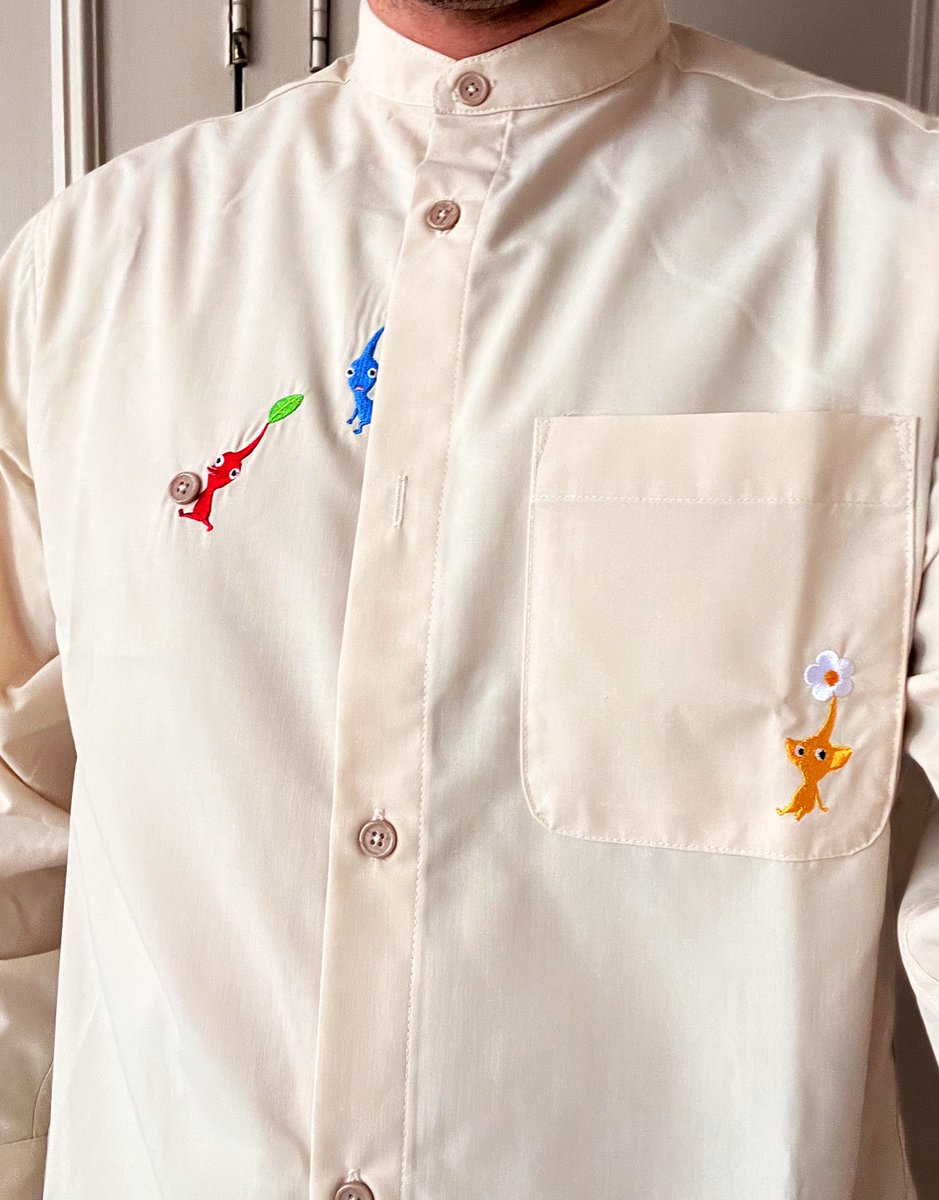 cazwis's tweet photo. This Pikmin shirt I bought has the little guys carrying away one of the buttons and I think thatβs fantastic. https://t.co/LcpgrbP01Y