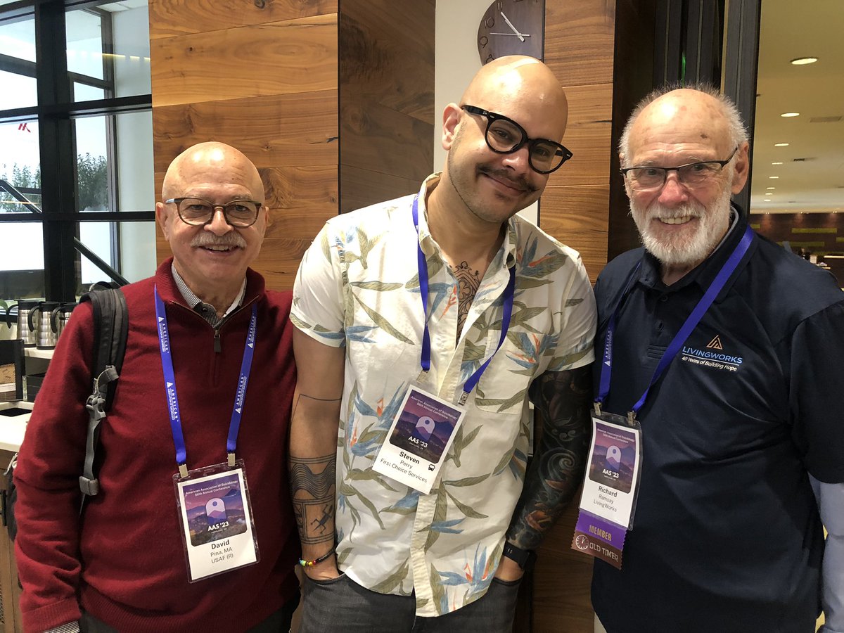WV988CrisisLine's tweet photo. We've learned a lot at #AAS23! Here's our Dir of Training, Steven Perry (middle), with developer of ASIST framework, Richard Ramsay (right), and Chaplain David Pina, @usairforce (left).The pic on right is our CEO Lata Menon and our WV 988 Director, Rozanna Bracken. https://t.co/LJTjQjgJx6