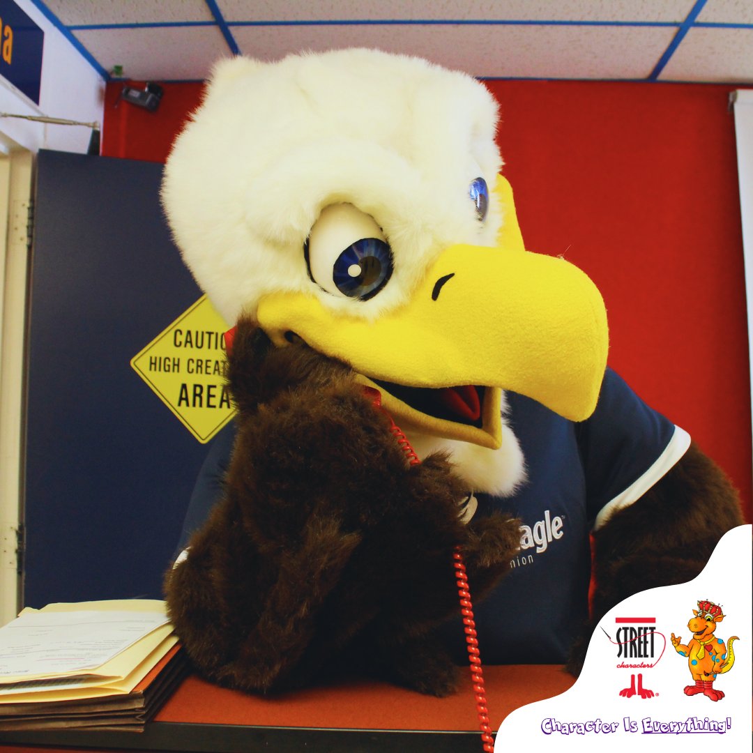 SCIMascots's tweet photo. When you're trying to soar to new heights but the phone won't stop ringing 🦅📞 Hang tight, I'll be with you in a flap of a wing! 

#EagleProblems #MascotLife #PhoneDuty https://t.co/V4OzHrCGdm
