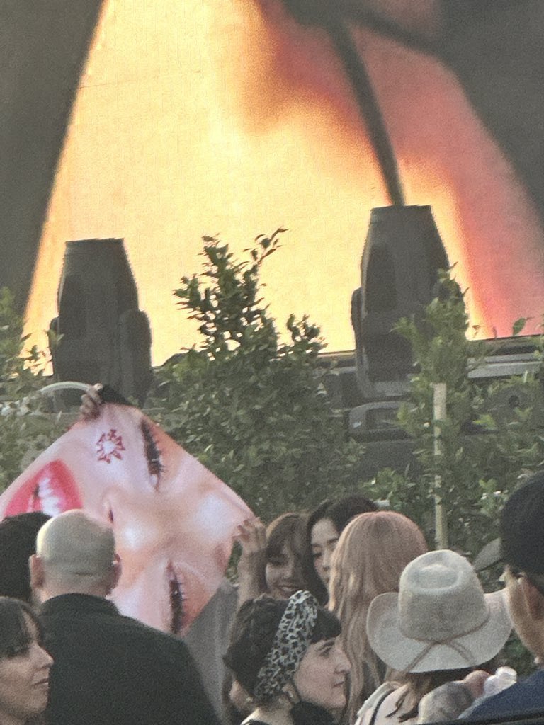 LISANATIONS_'s tweet photo. .@rosalia's biggest fan there, Lisa is holding a banner of her face 😍 

BOSSPINK LISA COACHELLA
#LisachellaReturns https://t.co/H7XZXS2m0g