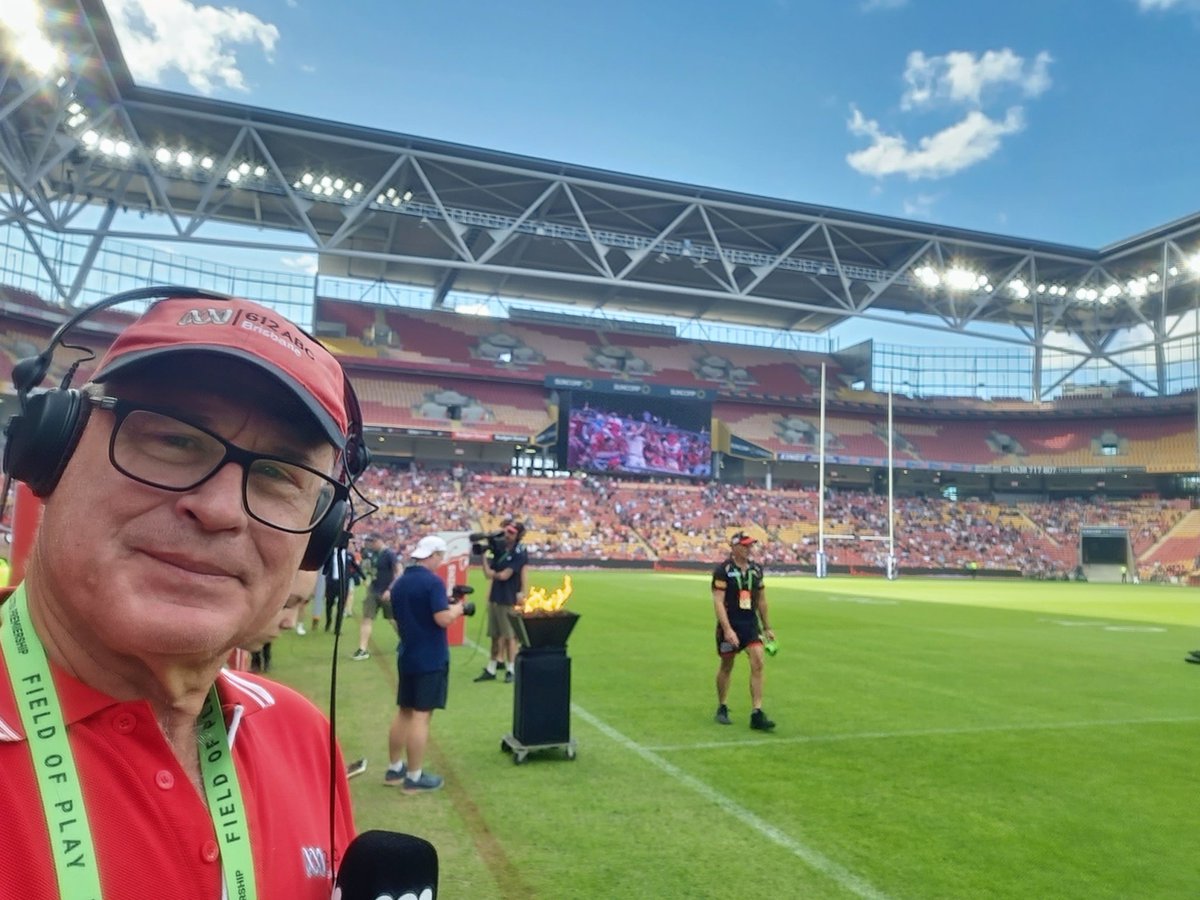 oz_bat's tweet photo. Excited and privileged to be on the sideline at Lang Park for the @NRL ANZAC Round match between @dolphinsnrl and @GCTitans to celebrate the 50th anniversary of my first gig for @abcsport running results at the Australian Surf Titles at Burleigh in 1973! #ABCSport #ABCGrandstand https://t.co/Mtu4t2fecp