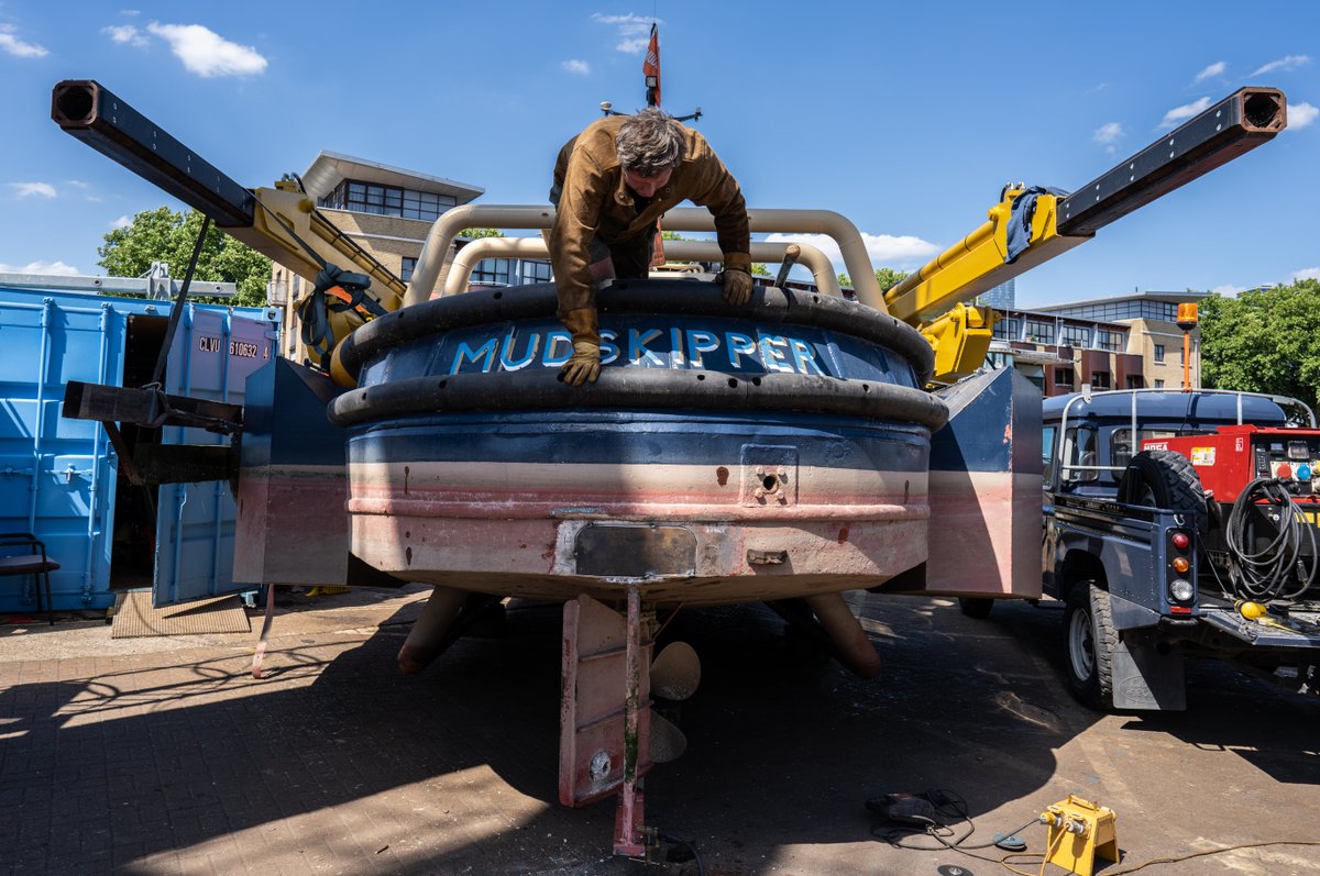 nikigorick's tweet photo. A WALKING SHIP #JamesCapper has brought his mobile sculpture, 
Mudskipper back to #SouthDock 
Marina. Created in 2019. Out of the water for 5 year check 
required by @LondonPortAuth Converted 80s Thames 
workboat - moves across water &amp; land on a set of hydraulic propulsion legs. https://t.co/bdr23lGAFi
