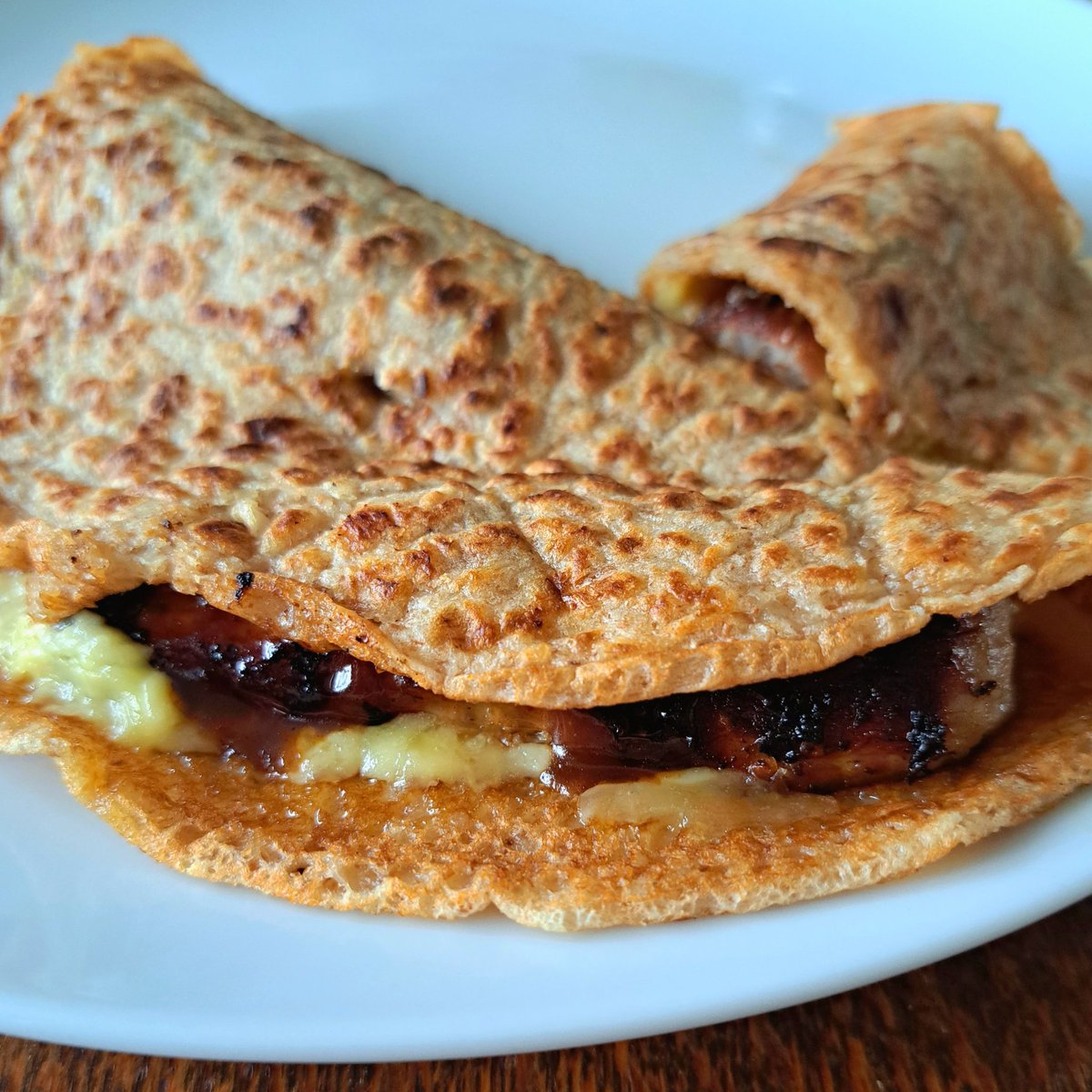 MoorlandsEater's tweet photo. Sunday breakfast: homemade Staffordshire oatcakes, sausage, cheese, brown sauce 😋. https://t.co/LWuO9655XO