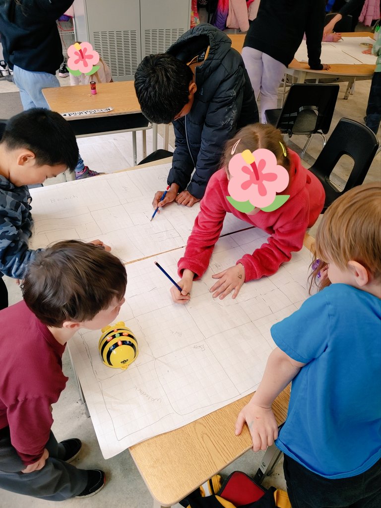 MsKThiel's tweet photo. Partner Power! Gr. 2 experts teach Gr. 4/5s how to program bee-bots. Together, Ss map a community. 

Focus on Direction: N/S/E/W (2s), Habitats: green spaces for local species (4s), Levels of Gov't: designing safe parks (5s) and so much more! @StAgnesCES #wcdsbNTIP #WCDSBAwaken https://t.co/Iuz8DoERc9