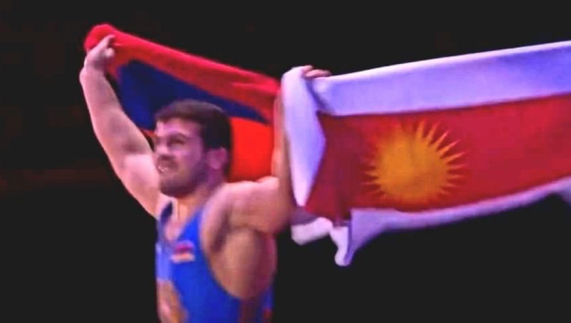 EzidiCulture's tweet photo. Be proud of your identity no matter where you are.

A Yezidi from Armenia “Malkhas Amoyan”, raised flags of both Yezidis and Armenia after winning a gold medal at the European champion.
#Êzidxan 
#YazidiCulture https://t.co/tpFkUbPEpv
