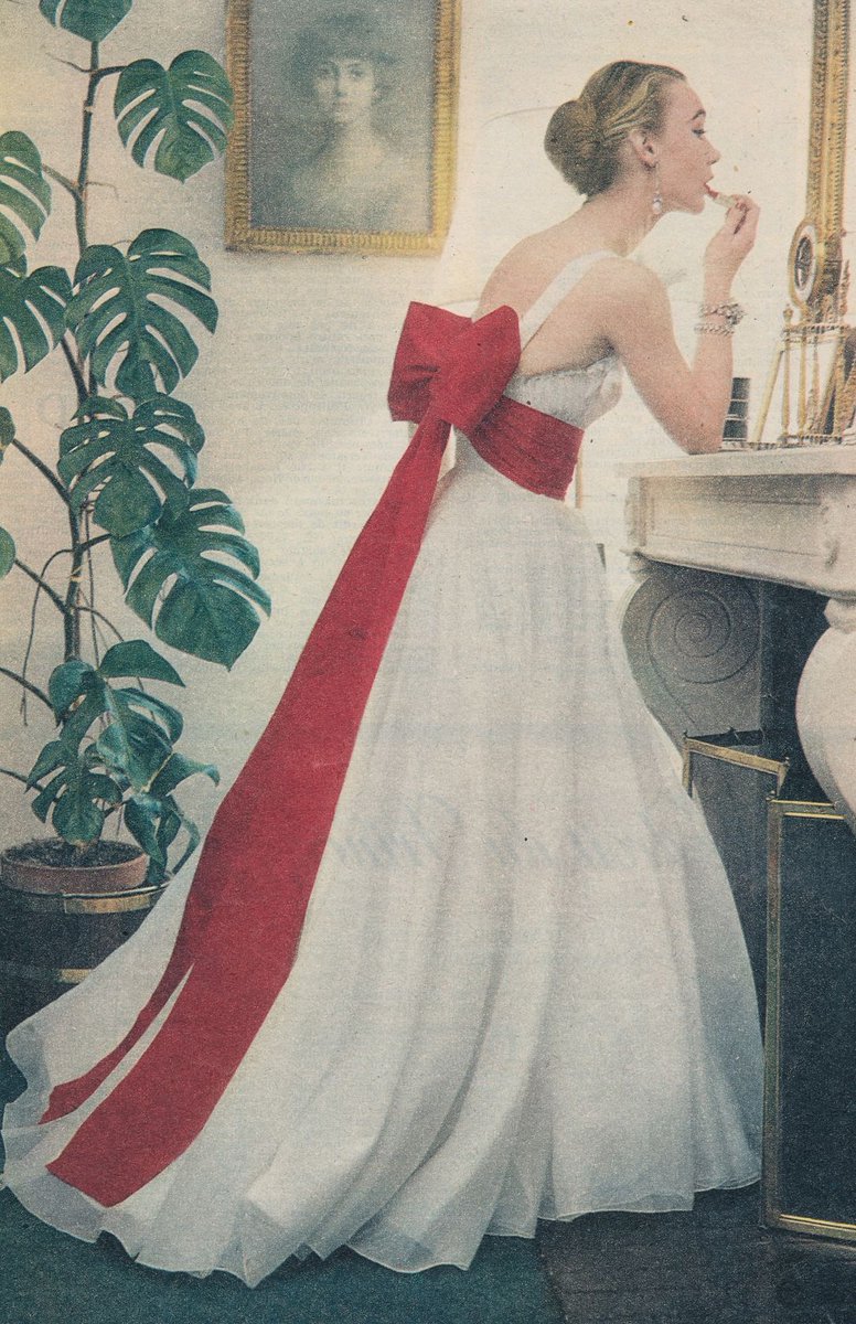 Amanda_Vickery's tweet photo. Sophie Malgat in white evening gown with large bow, Elle, March 1952.  Plus impressive cheese plant. https://t.co/VdQkWXCXqA