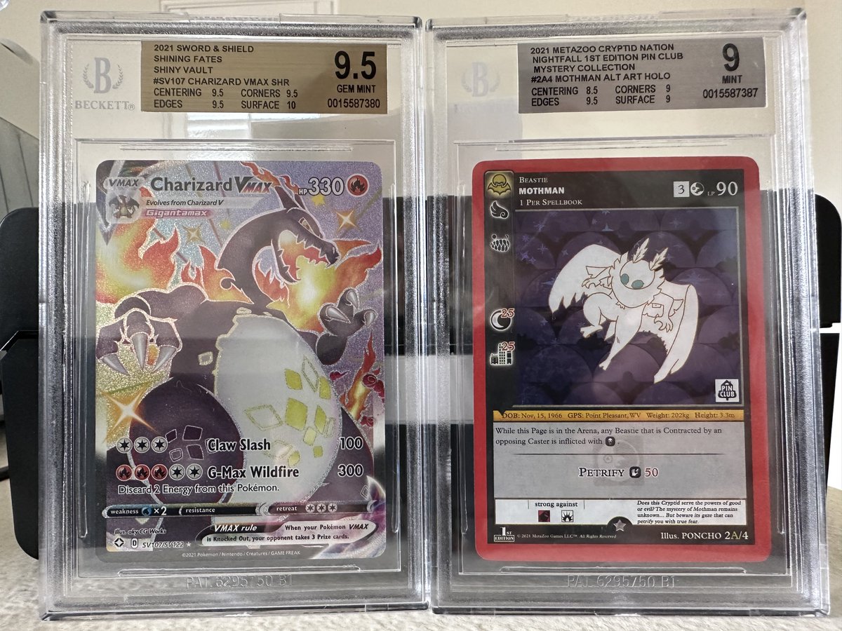 T3hTop's tweet image. Some more @beckettcollect submissions have returned 🥰. Super happy I got my @MetaZooGames Nightfall Pin Collection #mothman alt graded ( @JavizGaming pulled for me when I first started watching his streams)! I thought the #charizardvmax would score a 10, but I’m still ecstatic.