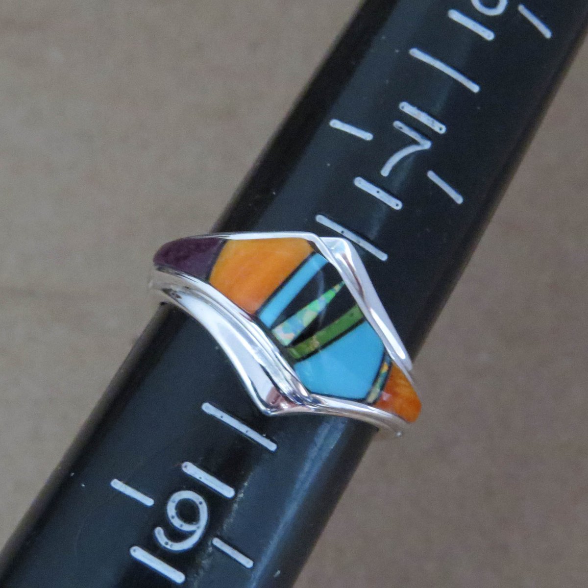 Beautiful Inlay Multi Gemstone Wave Ring ❤️️ etsy.me/3HsVt4O ❤️️ 
#navajojewelry #multigemstone #colorfulring #nativeamericanjewelry #navajohandmade #turquoisering #inlayring #sterlingsilverring #spinyoyster #etsyshop #etsyjewelry