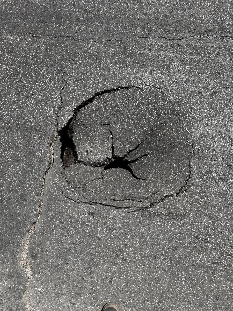 DemonDeprived's tweet photo. @nevadadot there's a pothole/ potential sinkhole on highland drive between W Red Oak Ave and FDNA Lane. Hard to tell from photos but it's hollow underneath!!! Almost made me crash https://t.co/4f6Opu8Tj6