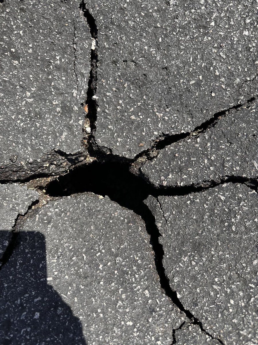 DemonDeprived's tweet photo. @nevadadot there's a pothole/ potential sinkhole on highland drive between W Red Oak Ave and FDNA Lane. Hard to tell from photos but it's hollow underneath!!! Almost made me crash https://t.co/4f6Opu8Tj6