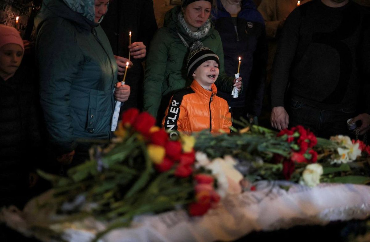 Instead of a thousand words. Uman. The funeral of children killed by a Russian rocket. RIP.