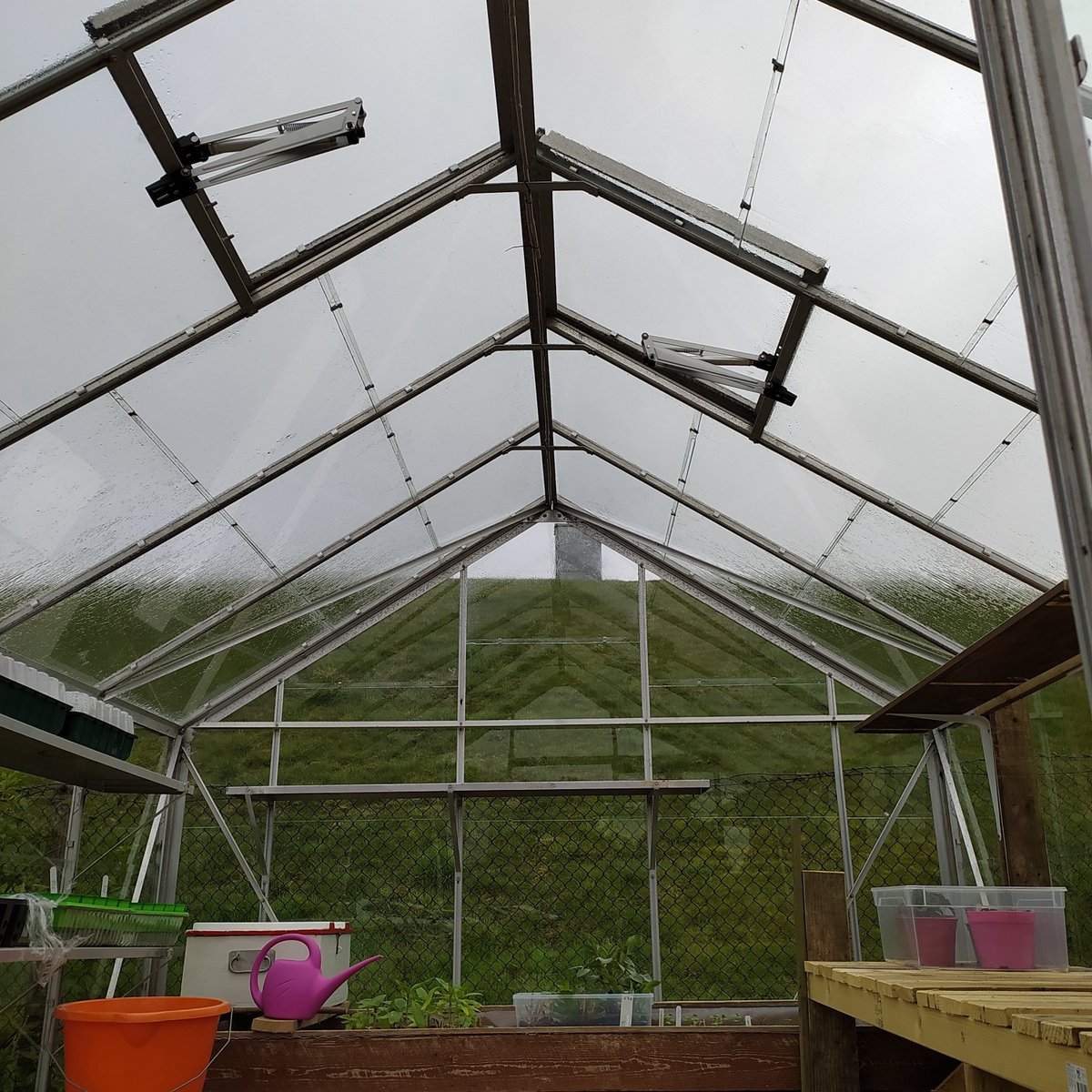 Lots of work being done for our upcoming plant sale on 20th/21st May. Post holes were dug for our new noticeboard. Ventilators fitted to our community greenhouse. Thank you to all our volunteers rewarded with cake and a cuppa. #allotment #slopefield #community #plantsale