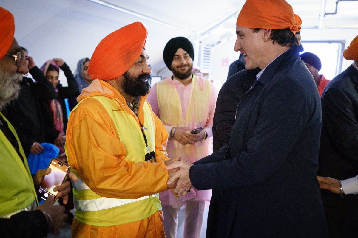 JustinTrudeau's tweet photo. From Vancouver to Edmonton to Toronto, I have fond memories of attending Vaisakhi celebrations. Today, we were back in Toronto for this year’s Khalsa Day parade – celebrating with friends old and new. Happy Vaisakhi! https://t.co/wWgEDEuJOo
