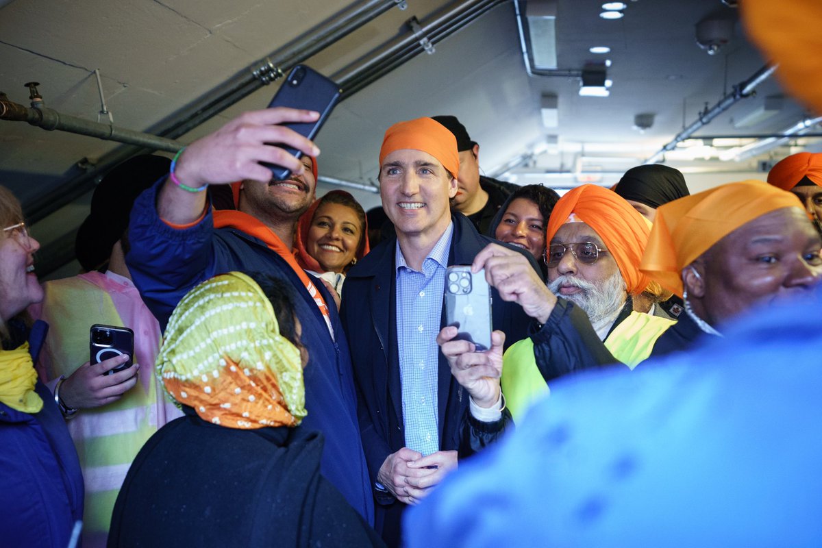 JustinTrudeau's tweet photo. From Vancouver to Edmonton to Toronto, I have fond memories of attending Vaisakhi celebrations. Today, we were back in Toronto for this year’s Khalsa Day parade – celebrating with friends old and new. Happy Vaisakhi! https://t.co/wWgEDEuJOo