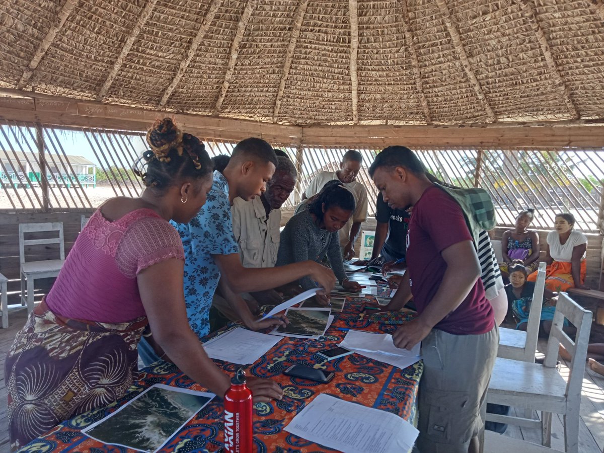 The students leading a focus group session with local village representatives to identify potential mangrove restoration sites