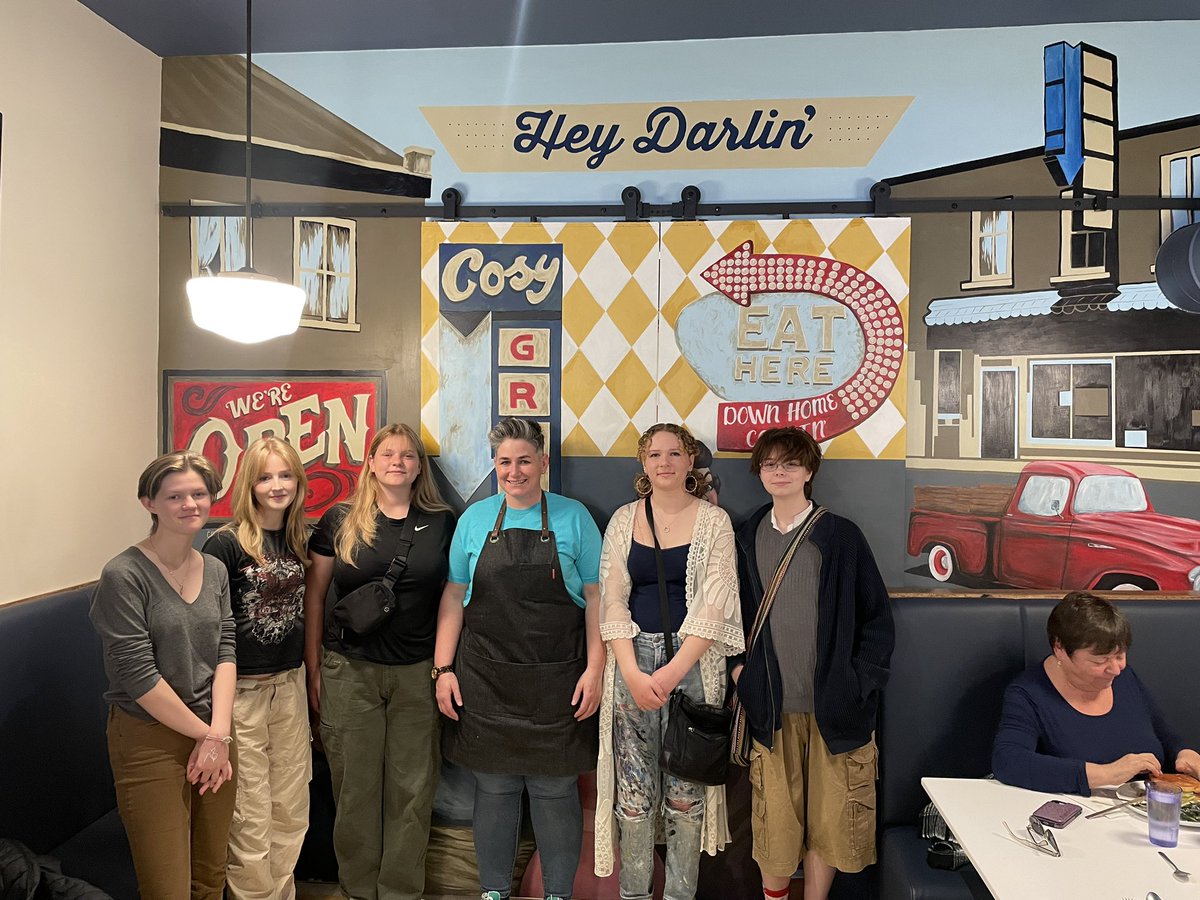 The finished mural, with restaurant owner Amanda Finkle