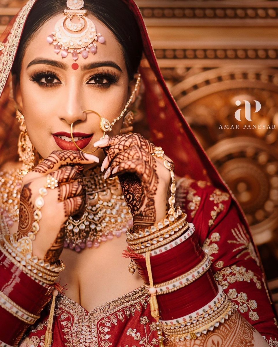 Dewy face &amp; red tones for the win!😍 We love how dramatically <a href="/ginibhogal/">Gini Bhogal</a> created this bridal look.⁠
⁠
🔗 l8r.it/Lz5q
⁠
Hair and makeup: <a href="/ginibhogal/">Gini Bhogal</a>⁠
Bride: <a href="/_sharann/">Sharan</a> 
Photography: @amarpanesar_
#bridalmakeup #weddingmakeup #khushwedding