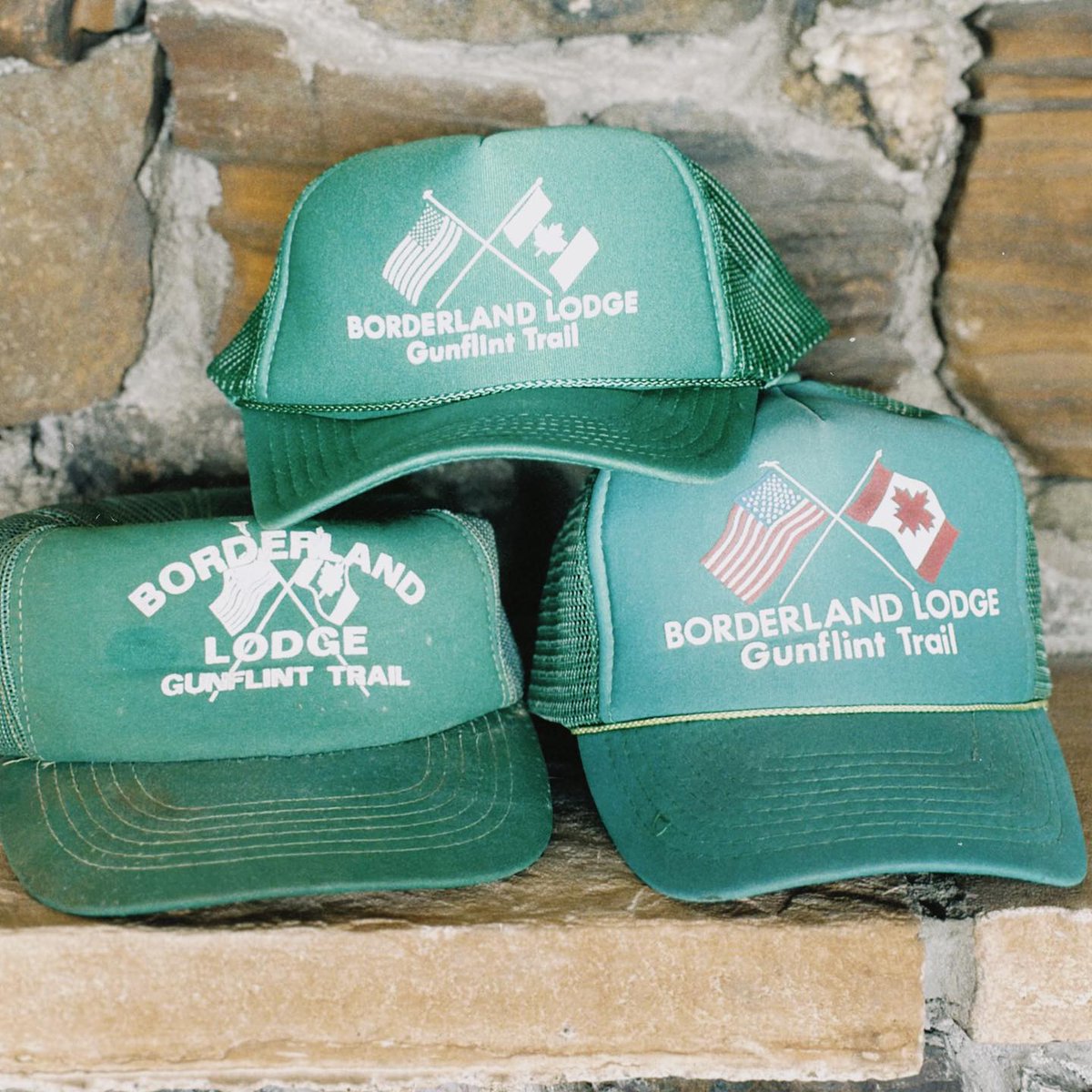 BorderlandLodge's tweet photo. What’s old is new again ✨ 

Three generations of Borderland Lodge trucker hats - the latest in-stock and ready to ship to you! Visit the bio link to order yours 🧢 
.
.
.
#borderlandlodge #truckerhat #merch #bwca #grandmaraismn #shop #mn #puffprint https://t.co/tv4YjVG86z