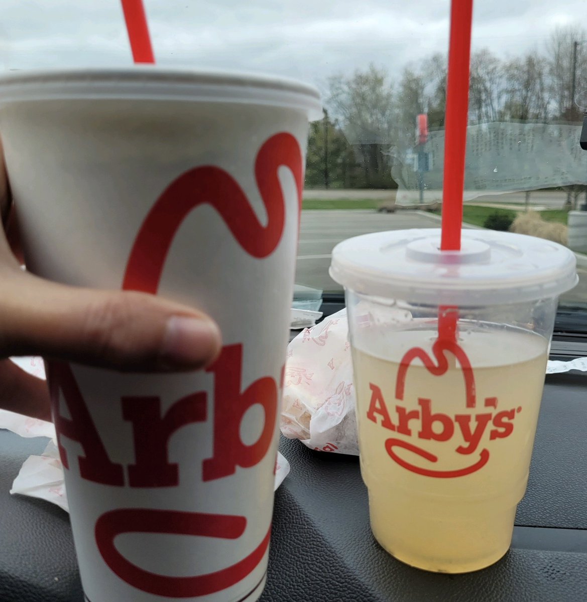 DomTheodore's tweet photo. @Arbys @ArbysCares what is happening here that the drink on the right is called “regular” and costs 2.89, and the drink on the left is called “large” and costs 2.79? PS the regular size is so small we thought it was a mistake. https://t.co/AZBPhndoIR