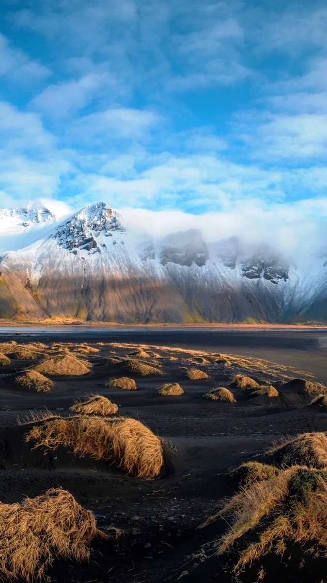 LoveSongs4Peace's tweet photo. Northern Iceland's snowy mountains and rocky coast  🇮🇸 https://t.co/t3IxM27CAF