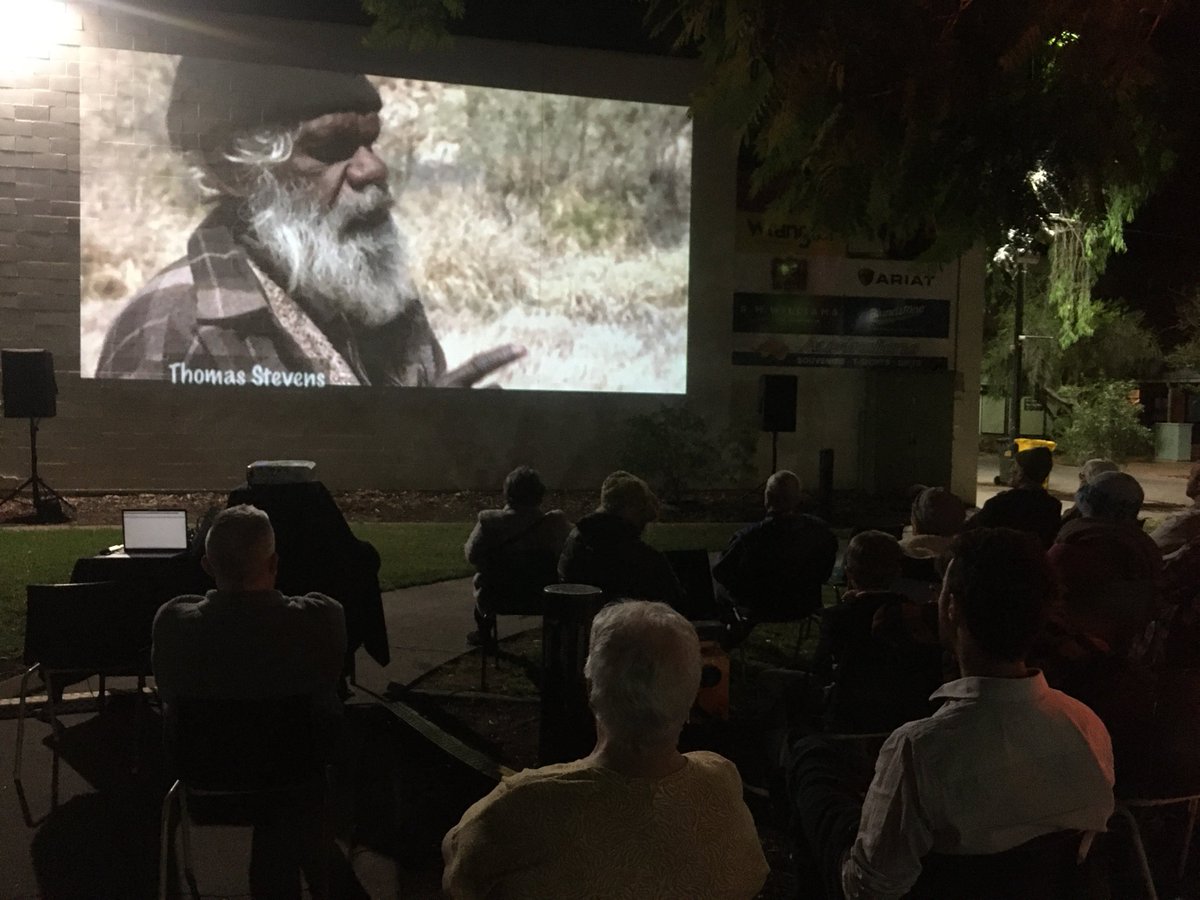 People gather in Todd Mall last Friday to hear about the sacred landscape of Mparntwe #AliceSprings &amp; the struggle to protect it. Pictured, the late Thomas Stevens, custodian. Screening was part of an event introducing the Reimagining Adelaide House Museum truth-telling project.