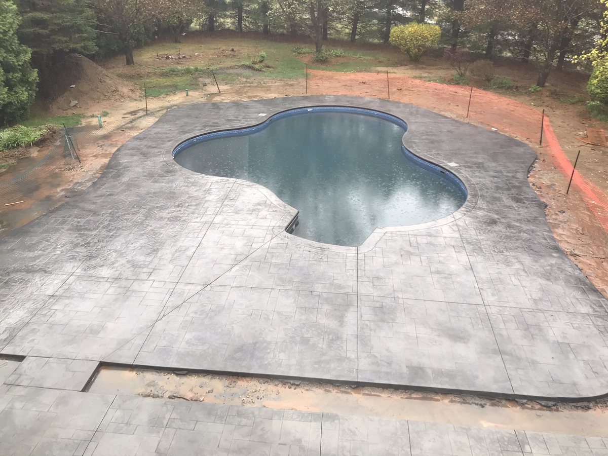 RobertBigman3's tweet photo. Here it is! It’s raining and shitty out but here is #OurMickeyPool concrete turned out amazing. More to come, stay tuned. 🥂❤️ https://t.co/ACtQYjEJqW