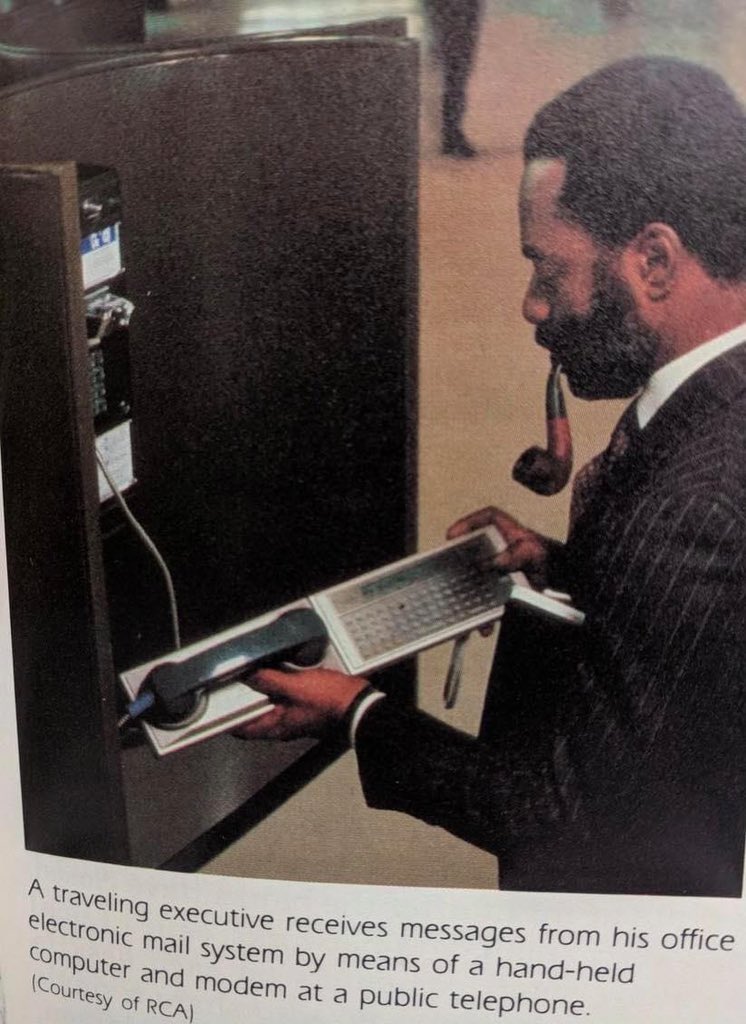 ComputerLove_'s tweet image. A businessman using an acoustic coupler to send an email with a payphone. #80s