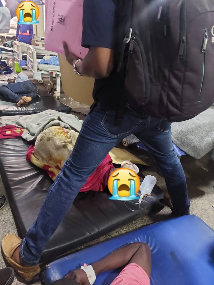 A doctor negotiating his way through patients on the floor at Mulago National Referral Hospital, Casualty. <a href="/MinofHealthUG/">Ministry of Health- Uganda</a> <a href="/DianaAtwine/">Dr. Diana Atwine</a> <a href="/ainbyoo/">Ainebyoona Emmanuel</a> @usmissionuganda <a href="/NRMOnline/">NRM Party</a> <a href="/KagutaMuseveni/">Yoweri K Museveni</a> <a href="/WHOUganda/">WHO Uganda</a> 
#UgandaHealthExhibition 📣📢