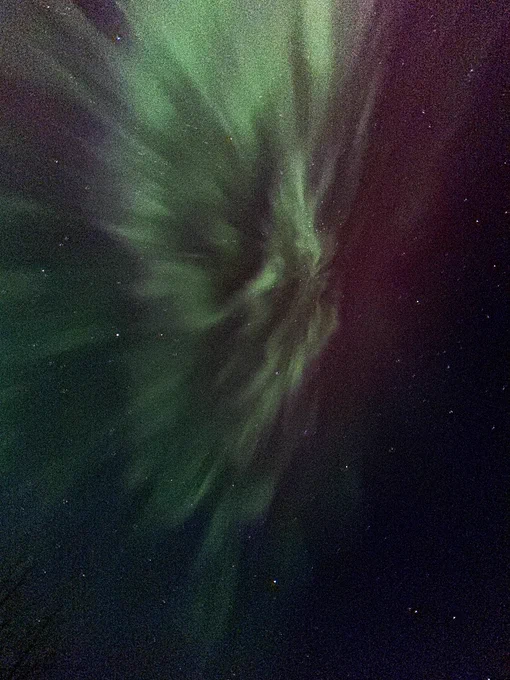 Aurora borealis looking directly up, with stars in the background