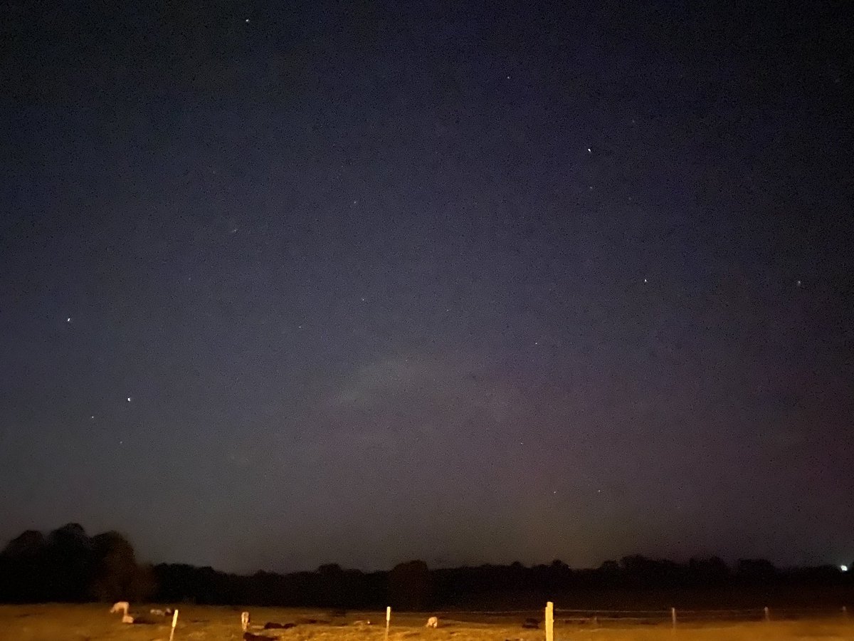 CoffeeMidtown's tweet photo. The Aurora from the Russellville area atop the backside of Crow Mountain. It’s a little grainy from the older iphone but was great to see nonetheless! Great night of aurora chasing with my daughter. #aurora #arkansasaurora #arwx #aurorarussellville #russellvillear https://t.co/U0UAvfFIIU