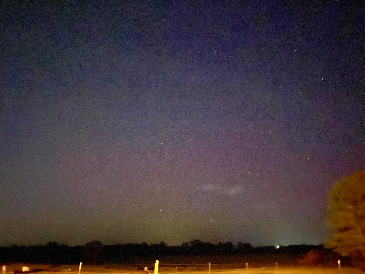 CoffeeMidtown's tweet photo. The Aurora from the Russellville area atop the backside of Crow Mountain. It’s a little grainy from the older iphone but was great to see nonetheless! Great night of aurora chasing with my daughter. #aurora #arkansasaurora #arwx #aurorarussellville #russellvillear https://t.co/U0UAvfFIIU