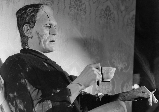 BORIS KARLOFF taking a well deserved break on the set of Bride Of Frankenstein (1935).