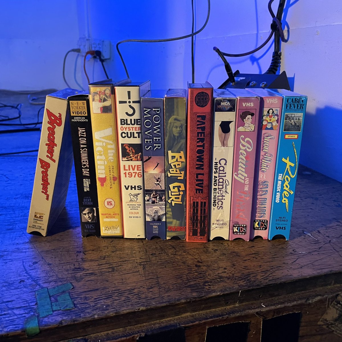 1. Tonight's "suggested tape"
2. The dedicated VHS rewinder that looks like a car (my first time seeing it; haven't been to <a href="/wondervillenyc/">Wonderville 🕹</a> for 2 months)
3. Our "house tapes"

Not pictured: my "emergency tapes" nor belated bd drinks, tho we JUST WENT LIVE

twitch.tv/wondervillenyc
