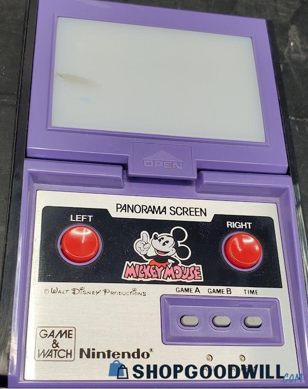 GoodwillGoblin's tweet photo. Game &amp; Watch Model DC-95, Panorama Screen Mickey Mouse, has appeared on Shop Goodwill. Panorama models had color screens that reflected off a mirror to increase visibility in lieu of a backlight. (last picture courtesy https://t.co/pPx5bfPQmy) https://t.co/ypBk01BJoA