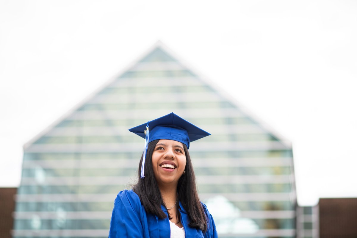 GVSU's tweet photo. Priscila Ontiveros Chucatiny is graduating on with a bachelor’s degree in computer science. A Bolivian native, she came to Michigan for another school, but transferred to GVSU after visiting campus for a robotics competition. 💙🎓#GVGrad 

Read more here: https://t.co/DeEoLivtKZ https://t.co/oVUI8JiS9t