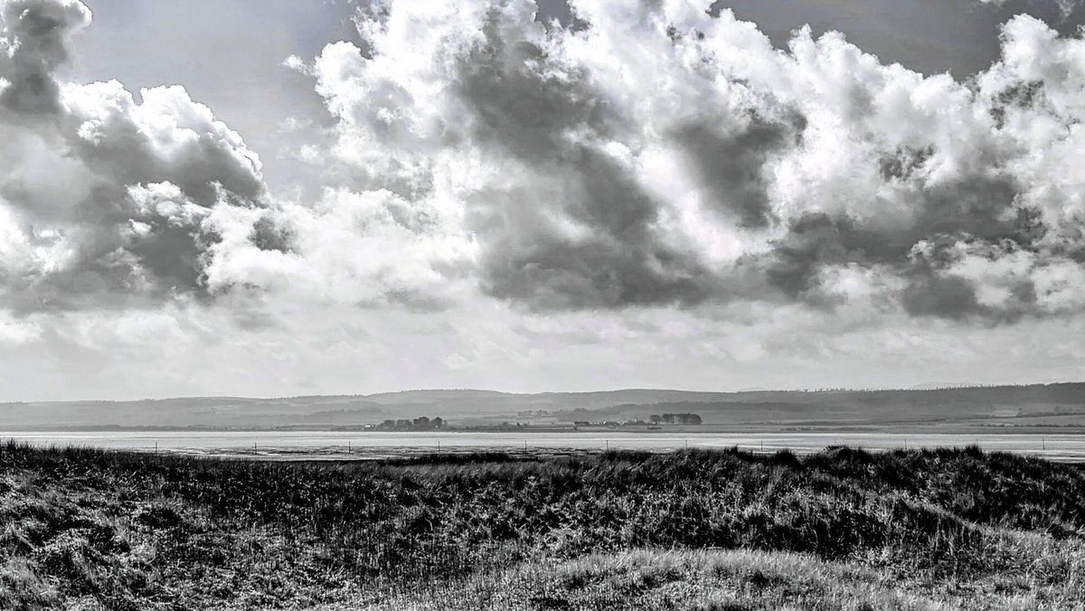 Looking back at  @NTNorthd_Coast from
the #HolyIsland of #Lindisfarne #Clouds
#landscapephotography
#WildLandscape
 @visitneengland #Blackandwhitephotography @SeaSkyCraster @2northumberland