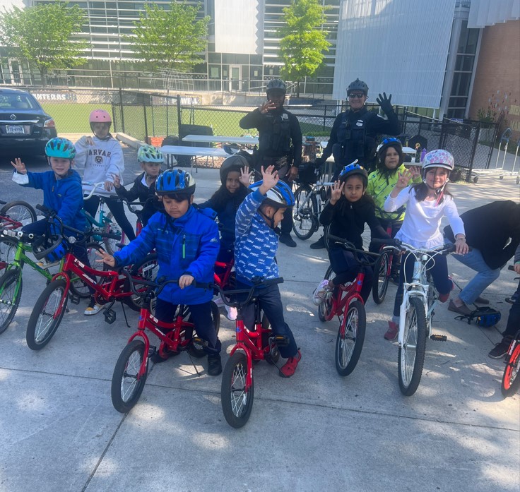 DCPoliceDept's tweet photo. The Fourth District Outreach team and some help from  a few mountain bike officers were out with the students for the Powell Elementary School Bike Ride. 🚲👏 https://t.co/7ChpsgCMzs