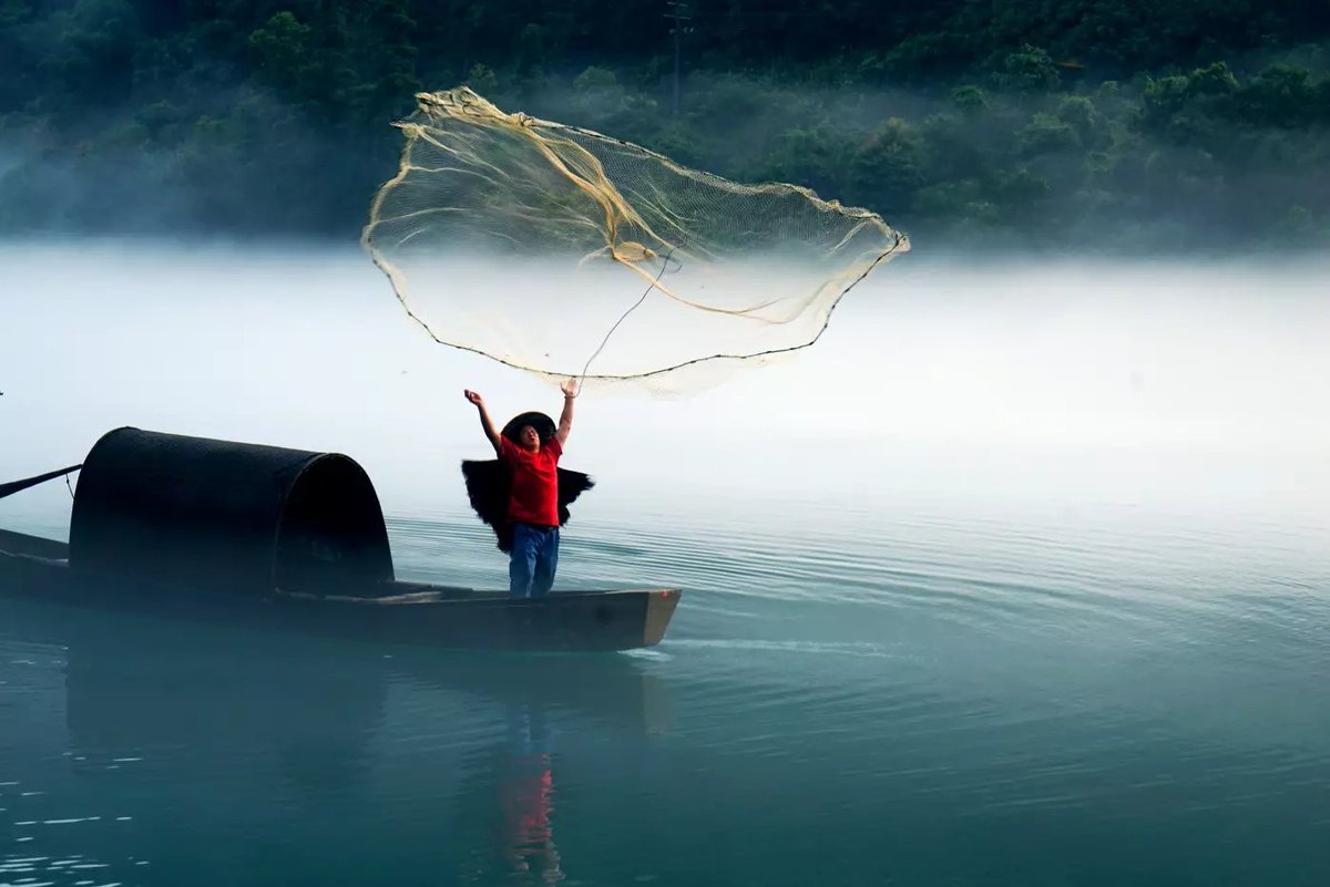 A fishermen cast nets in the dreamy landscape.   #beautifulphotos