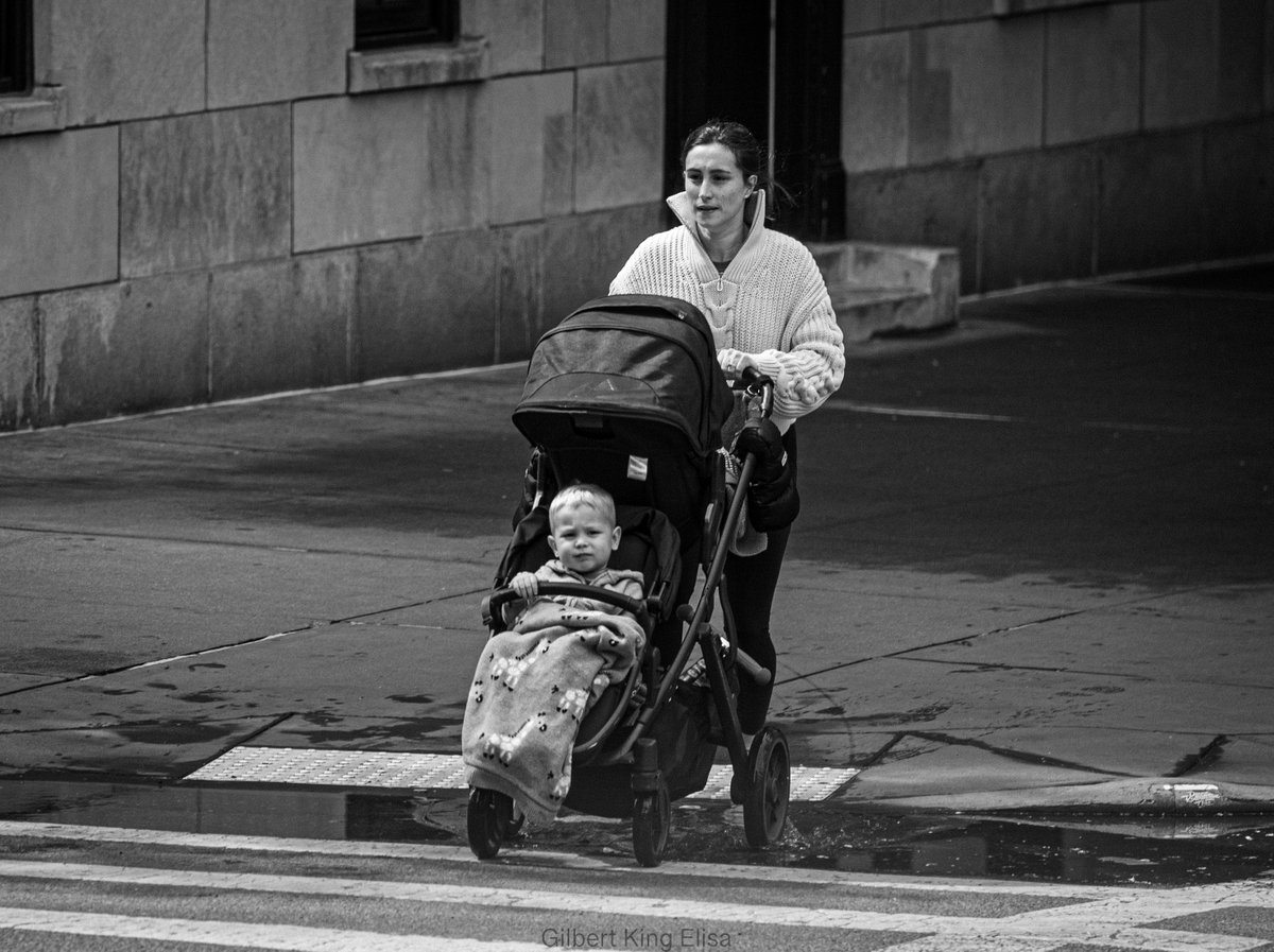 Come On, We're Almost There #GilbertKingElisa #NYC #Manhattan #traveling #photography #streetphotography #newyorkcity #baby #morning #travel #travelphotography #bw #cityscape #peoplewatching #babycarriage #buildings #peoplephotography #mother #bnw #traveling  #streetphotographer…