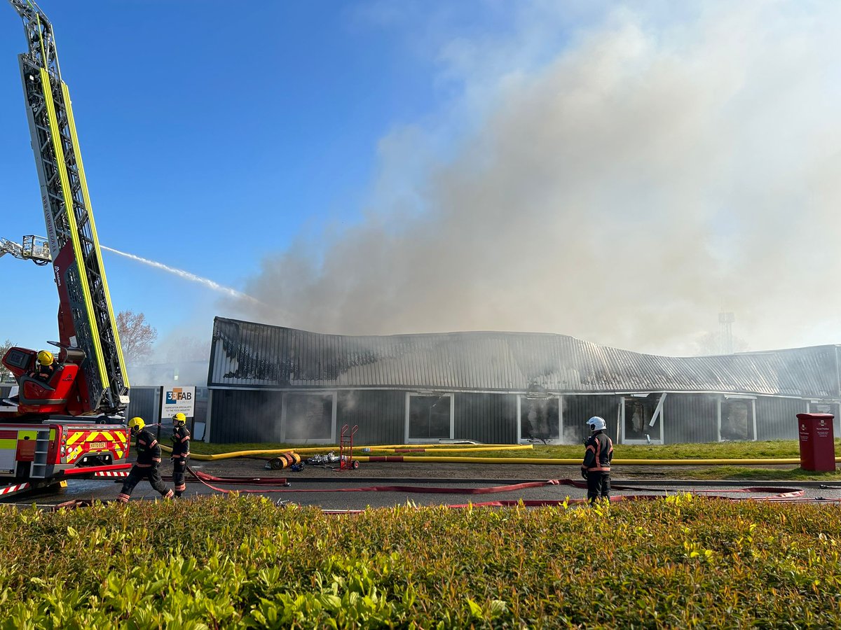 northantsfire's tweet photo. Residents are still being asked to keep their windows and doors closed if they are nearby to the fire we are currently attending at the Earlstrees Industrial Estate in Corby. https://t.co/7P4NpUR5El