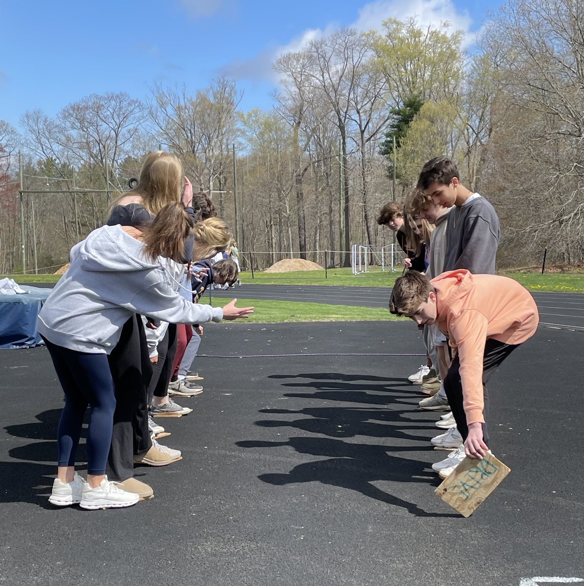 WELLNESS FOR LIFE students demonstrate teamwork and collaboration while participating in Stepping Stones.