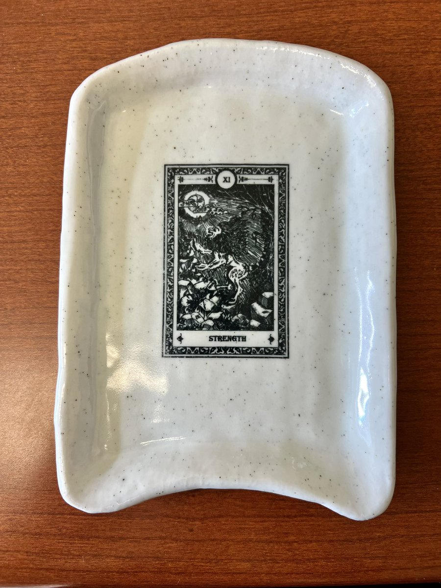 DrEdenWales's tweet image. A @colbysawyer student made me a ceramic tray with the Tarot card for strength stenciled on it. #HigherEd leadership definitely requires strength and artistry. Now I’ll have both. 💙🤍 I love our students and this job. #CSCArt #CSCStudentsCreate