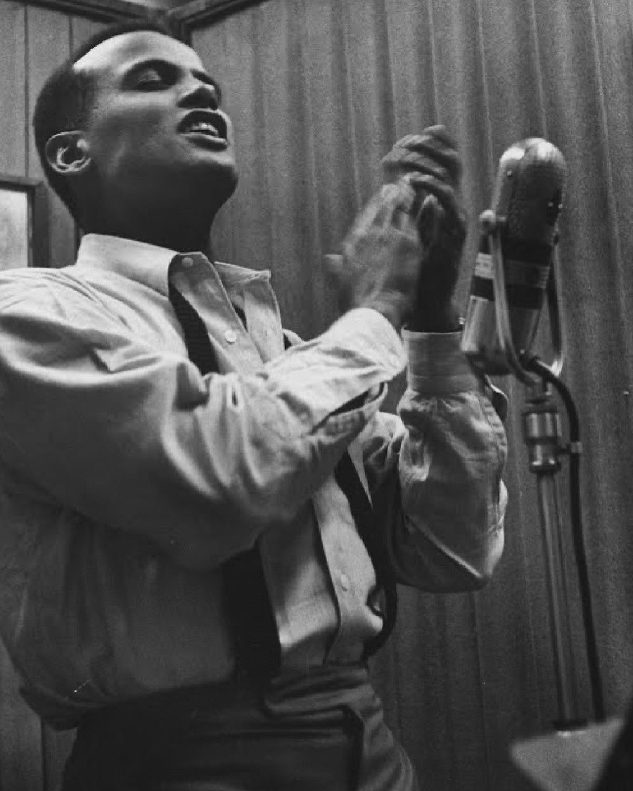 blackarchivesco's tweet photo. Photograph of Harry Belafonte performing at a recording session by Yale Joel (1957) via the LIFE Photo Collection https://t.co/KxszJcLatU