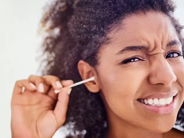 The brownish substance you sometimes find in your ears is called ear wax.

Don’t remove them.

They’re there to protect your ear from dirt and other foreign particles that could damage deeper structures, such as your eardrum.

Leave them alone!