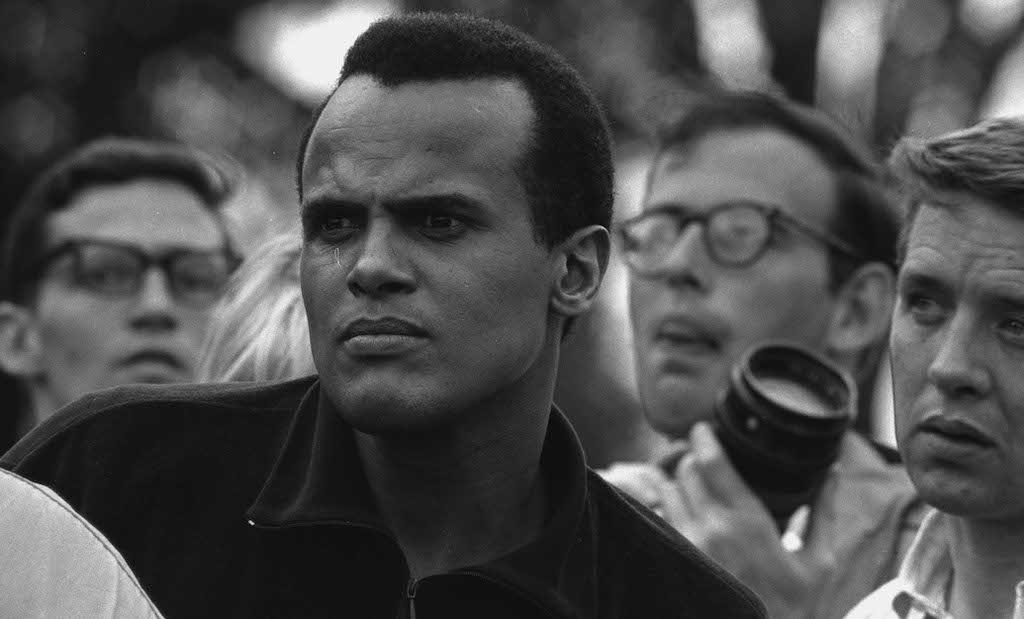 The Briscoe Center is saddened by the death of Harry Belafonte. The singer, actor, and civil rights leader is seen here during the 1965 Selma march (photo from the Charles Moore collection). Belafonte graciously appeared in our film "When I Rise."

briscoecenter.org/projects/when-…