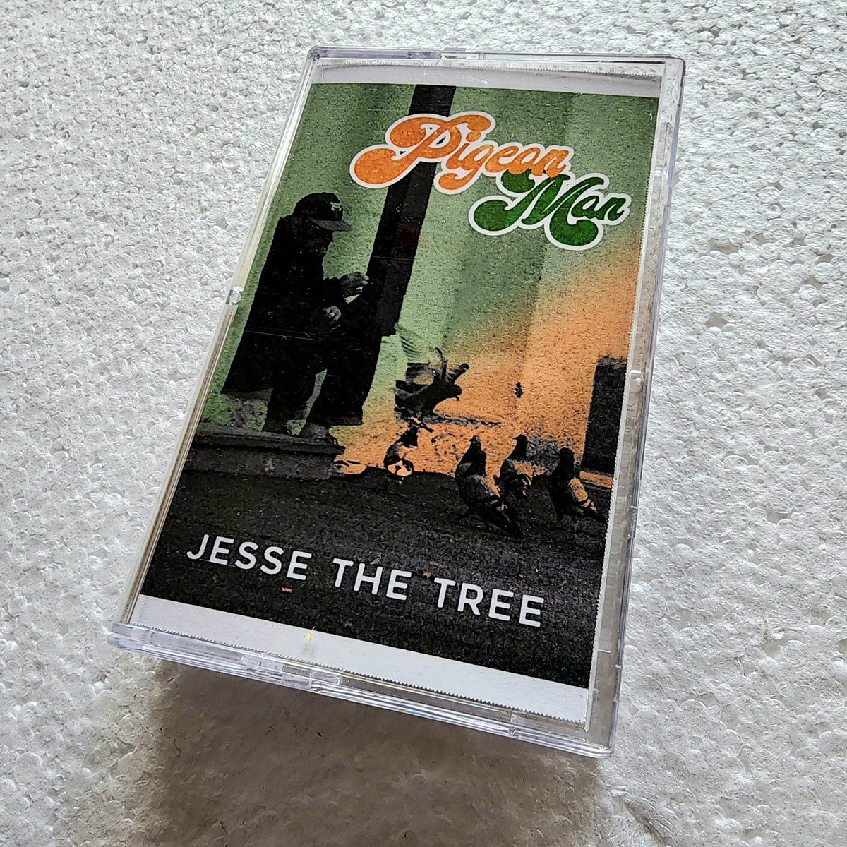 SFRupdates's tweet photo. #TapeTuesday: BACK IN STOCK @ https://t.co/1dU8CiImGq! 

The 1st run of 🟩-shelled @JesseTheTree401 #PigeonMan tapes went quick, so we brought 'em back in ⬜! 

The SFR debut of the 🌲 is produced by @Mopes_SFR + feat @SageFrancis, @ItsEarly, @Runtski of @JivinScientists, &amp; more! https://t.co/A6r3DAPhm2
