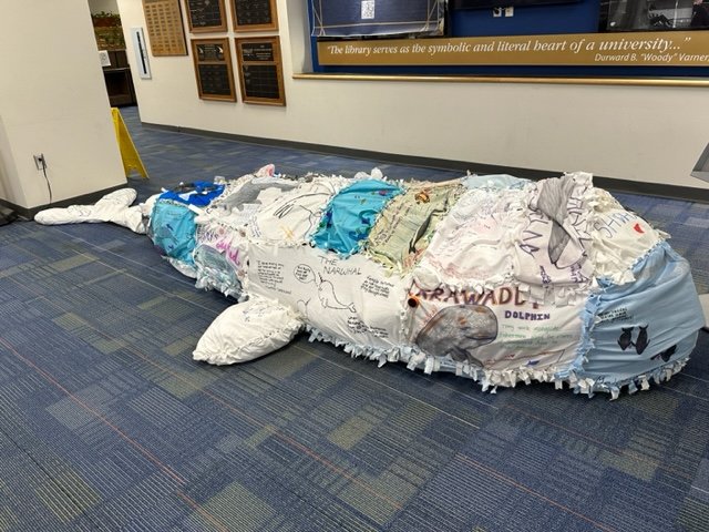 OULibraries's tweet image. Congrats to Professor Jeff Insko and his students from ENG 3681, Literature and the Environment, for creating a "whale" of a cool project. "Ishwhale" is stuffed with plastic and symbolizes the impact that humans have on the environment. Come see him in the library lobby this May!
