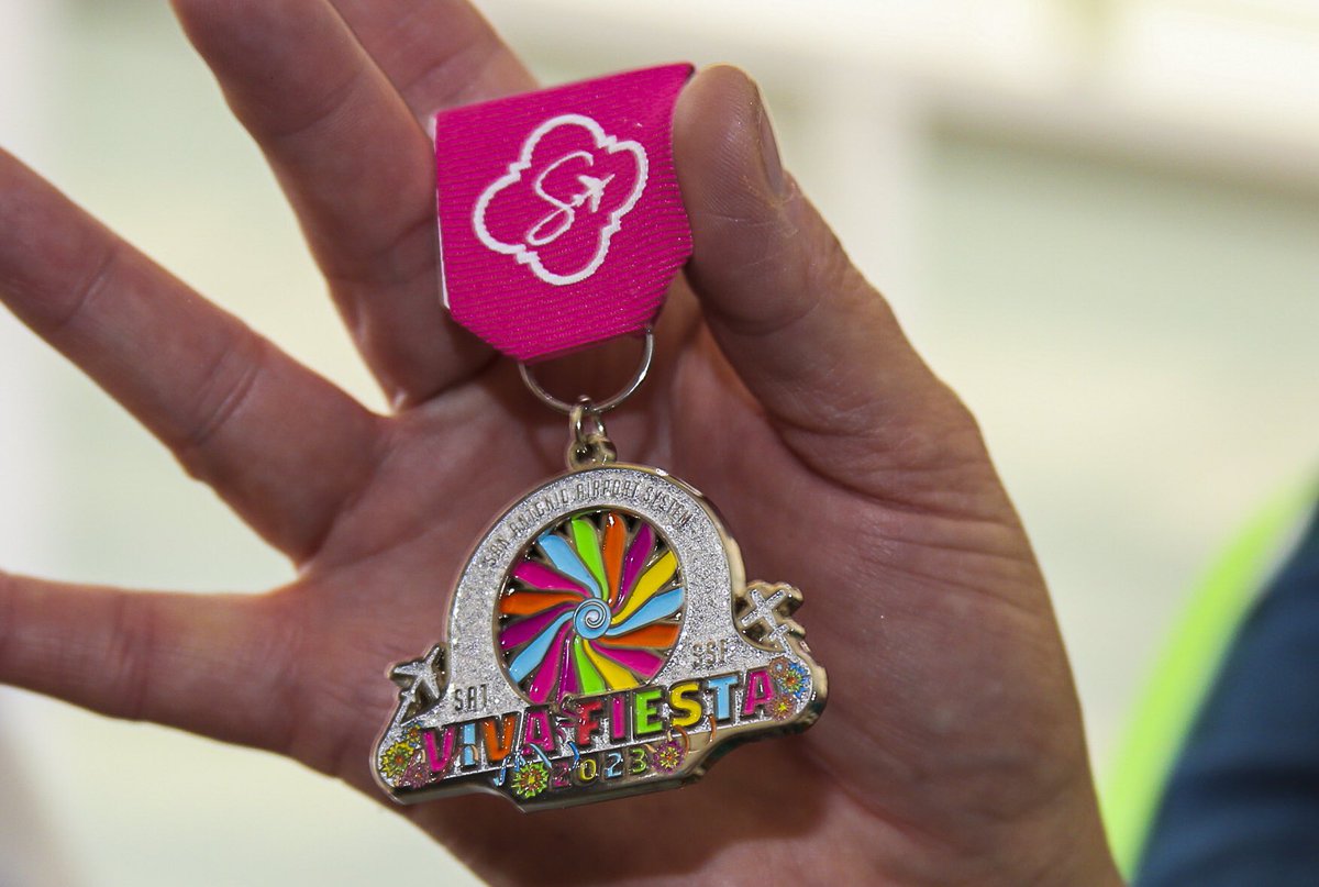 SATairport's tweet image. 2023 SAT Fiesta Medals have touched down in the 2-1-0! This year’s airport medal runs on jet fuel and is not for sale! The only way to add this “Fly Easier” feature to your fiesta fit is to like and retweet! Winners will be chosen tomorrow night🏅🙌🏅#flyEasier #flySanAntonio