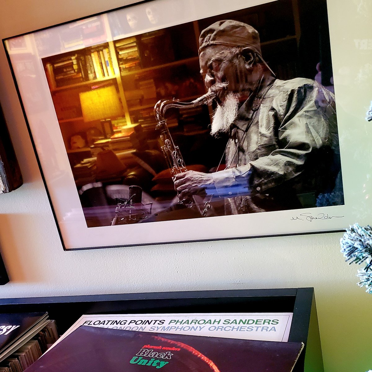 CatHeadRoger's tweet image. A belated ​THANKS​ to music photographer extraordinaire Mark Sheldon for the awesome birthday present I finally got up on the wall! ​The  late-great Pharoah Sanders now watches over my record collection​ (right next to Archie Shepp)​.​​ #supercool